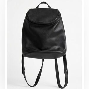 Vintage Longchamp black pebbled leather backpack medium size silver hardwear